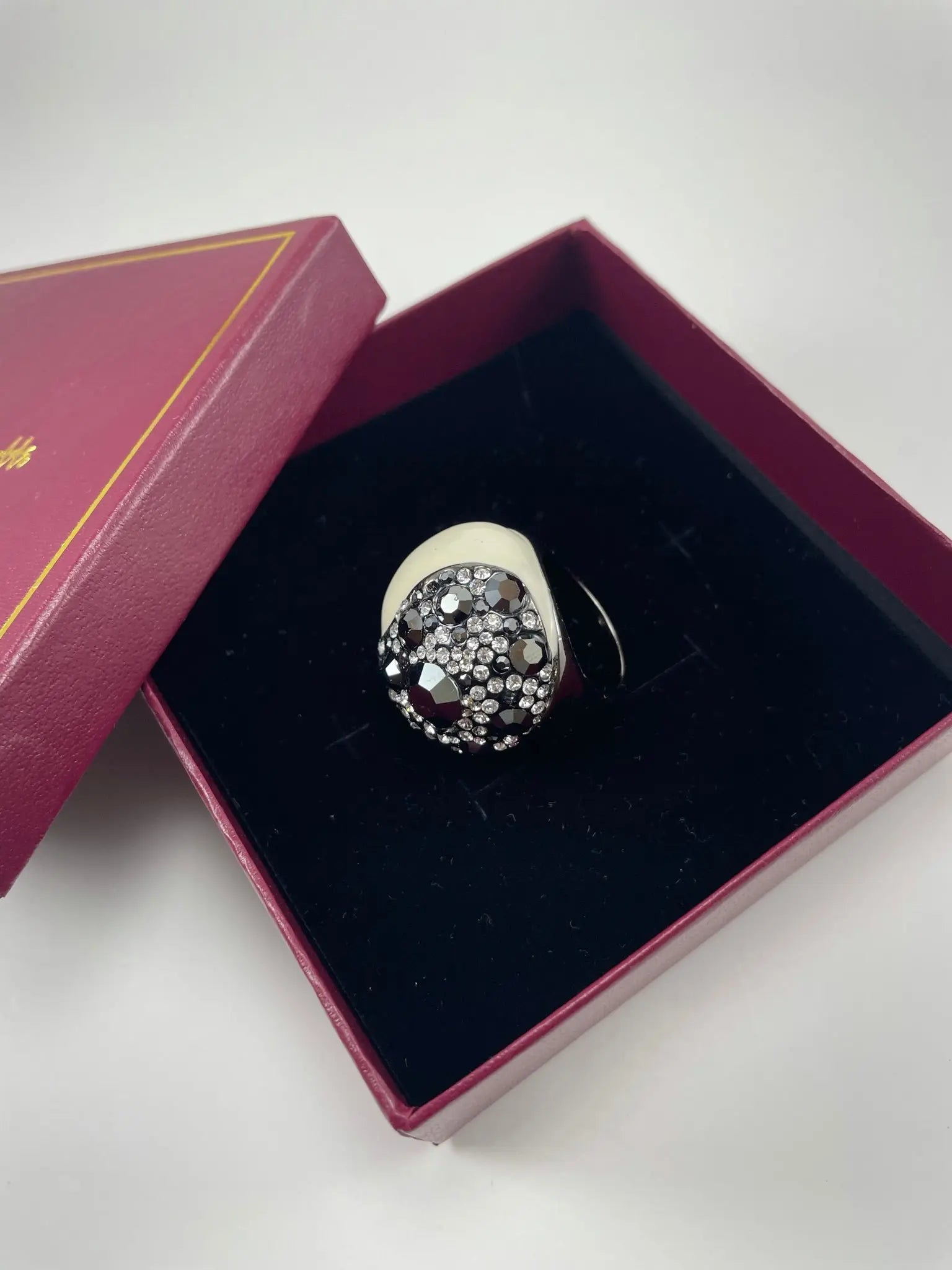 A luxurious Bennett Cocktail Ring displayed in a pink box, featuring a stunning luxury women's rings